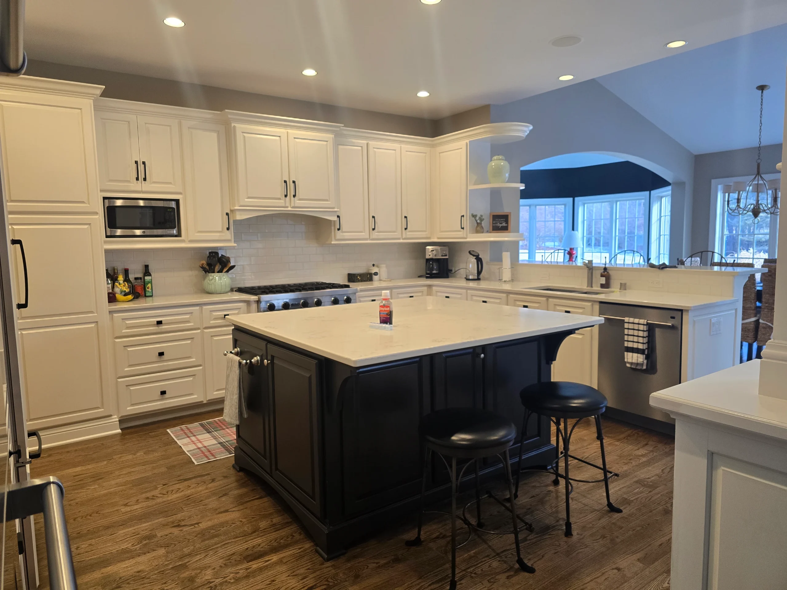 after-photo-of-clean-kitchen Pearly white kitchen with black accents, freshly deep cleaned.
