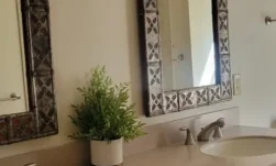 Clean and tidy bathroom counter with two sinks.