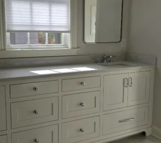clean-bathroom-move-out White bathroom with and empty white vanity after a move out deep cleaning.
