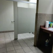 Freshly deep cleaned men's bathroom in a medium sized commercial building.
