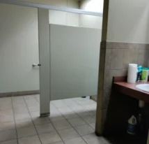 Freshly deep cleaned men's bathroom in a medium sized commercial building.