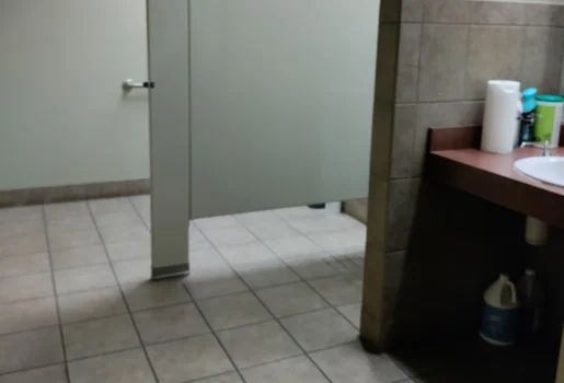 Freshly deep cleaned men's bathroom in a medium sized commercial building.