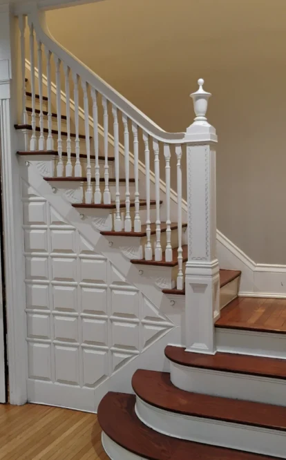 Freshly cleaned and mopped white and brown stair case after a deep clean for a move out.