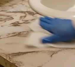dry-sink Drying a sink with a clean and dry paper towel.