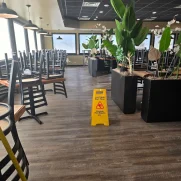 Dining room after mopping for a routine restaurant cleaning.