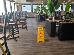 Dining room after mopping for a routine restaurant cleaning.