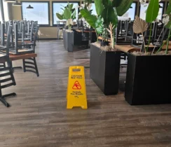 Dining room after mopping for a routine restaurant cleaning.