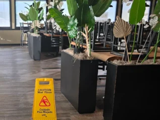 Dining room after mopping for a routine restaurant cleaning.