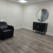Shiny salon studio gray floor after a move-out deep clean.