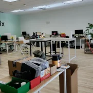 Open office with many desks after a routine clean mopping.