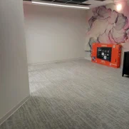 Empty office with a few boxes after a move out deep clean.