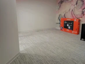 Empty office with a few boxes after a move out deep clean.