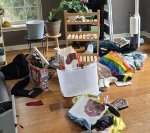 messy-room-before-cleaning A messy area before decluttering and cleaning services.
