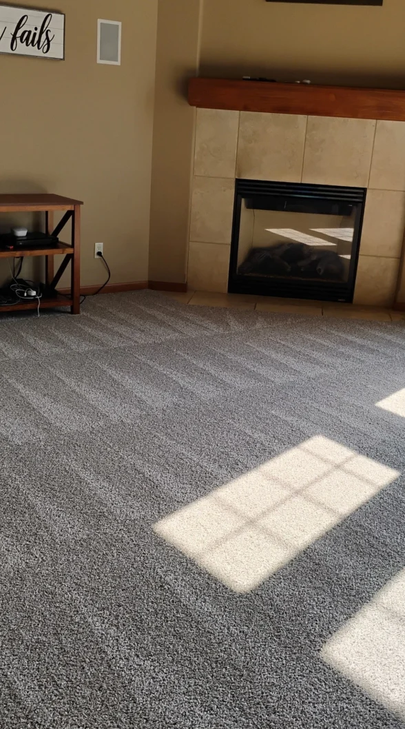 Satisfying vacuum lines on large gray living room carpet with a sunny view.