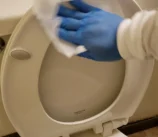 scrub-3-toilet-seat Scrubbing the toilet seat for a deep clean move out service.
