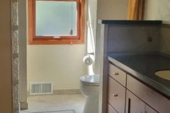 After photo of a recently deep cleaned modern bathroom after move-out.