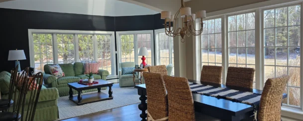 Clean and tidy living and dining room after a routine clean with a scenic view.