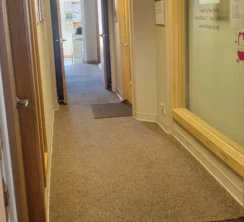 Clean office hallway after a routine vacuum.